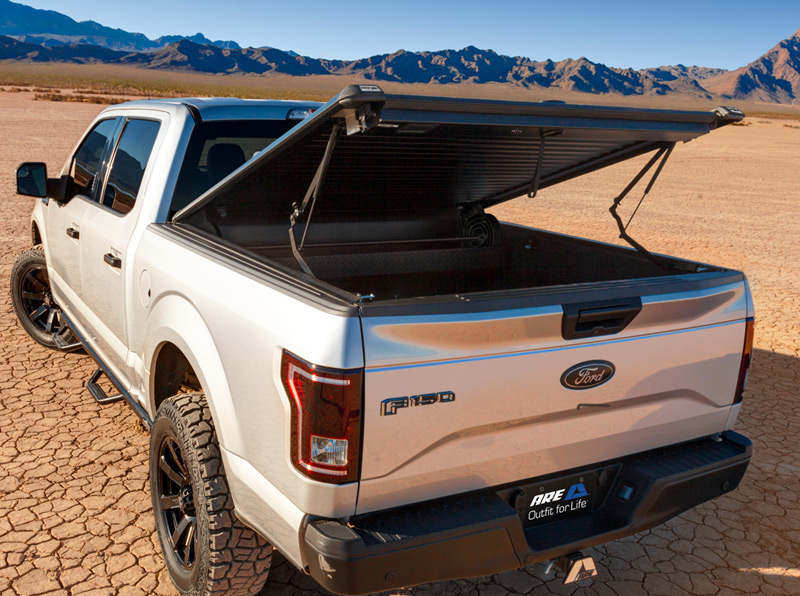Truck bed covers and spray-in liners